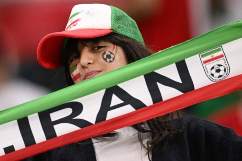 An Iran fan supports her team at a game against the US side at the Qatar 2022 World Cup
