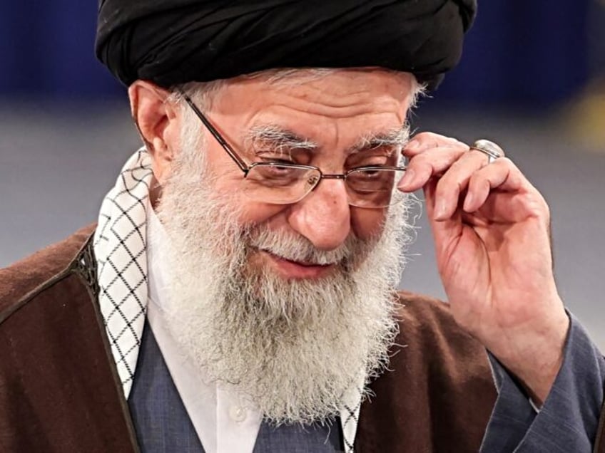 Iran's supreme leader Ayatollah Ali Khamenei adjusts his eyeglasses as he speaks after cas