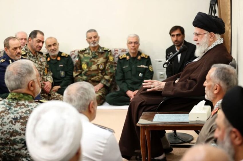A handout picture provided by the office of Iran's Supreme Leader Ayatollah Ali Khamenei s