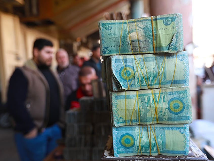 iraq bans withdrawals and transactions in us dollars