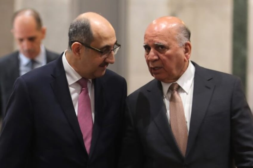 Iraq's Foreign Minister Fuad Hussein welcomes his Syrian counterpart Bassam al-Sabbagh ahe