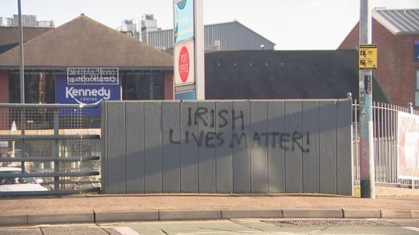 irish lives matter graffiti in belfast signs against rehousing illegal migrants spark hate probe report