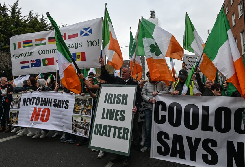 DUBLIN, IRELAND - MAY 6: Thousands of Irish protesters gathered in Dublin city center for an Anti-Mass Immigration protest, starting at the Gardens of Remembrance and proceeding through O'Connell Street, on May 6, 2024, in Dublin, Ireland. Since November 2022, Ireland has seen protests over temporary asylum seeker shelters due to a refugee surge, hitting 81,256, up 748.98% from 2021. With immigration surging in 2023 and currently, Irish citizens express growing outrage and frustration. (Photo by Artur Widak/NurPhoto via Getty Images)