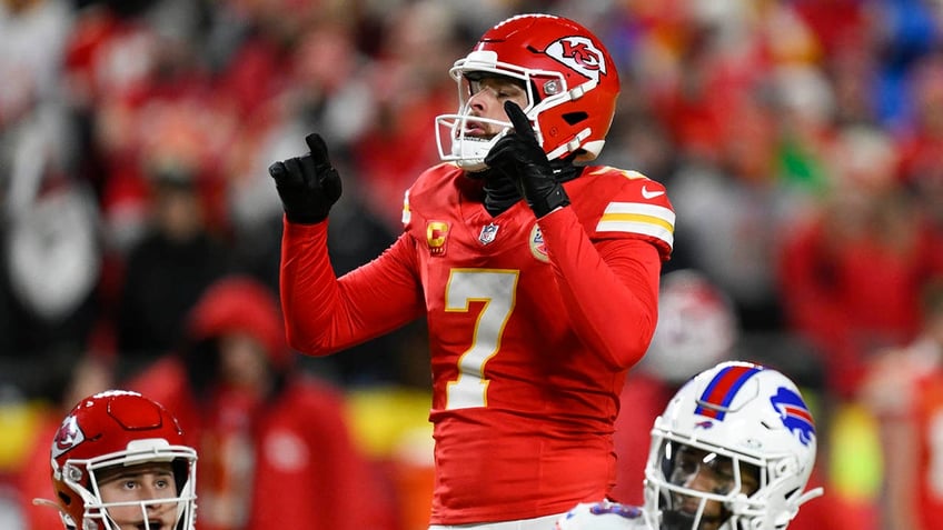 Harrison Butker points to the sky