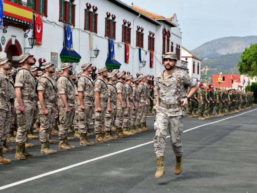 CEUTA, SPAIN - APRIL 28: A soldier runs during the farewell ceremony for the 130 soldiers