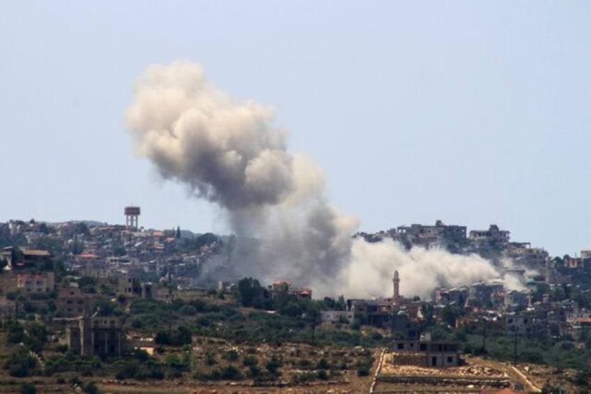 The aftermath of an Israeli air strike on the south Lebanon village of Aita al Shaab near