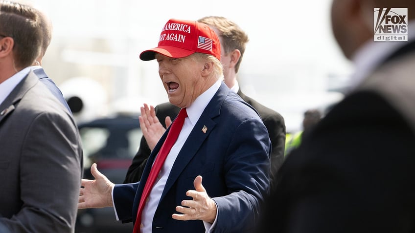 Former President Donald Trump arrives at Atlanta’s Hartsfield-Jackson Airport in Georgia