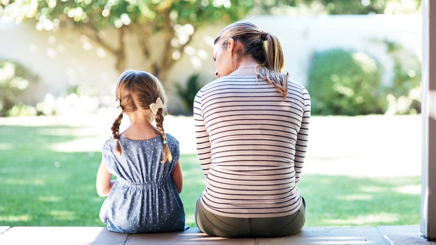 Parent and daughter talking