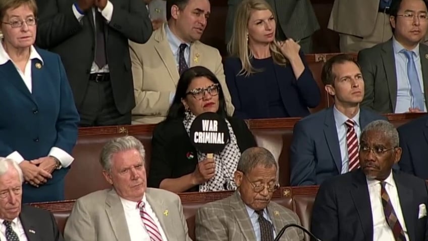 Anti-Israel Rep. Rashia Tlaib holds up sign that says 'war criminal' at Netanyahu address