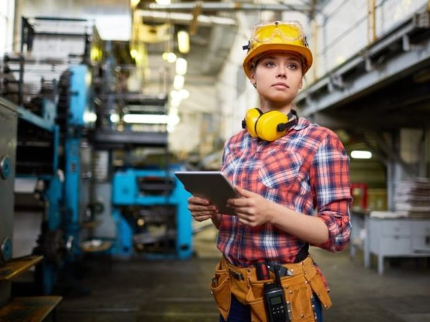 Woman at work in factory.