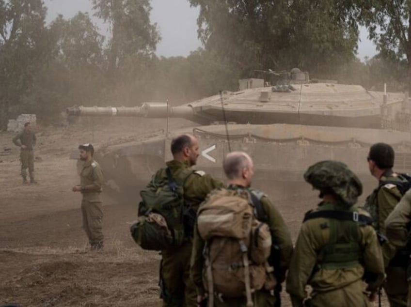 israel advances tanks to gaza city blocks major road