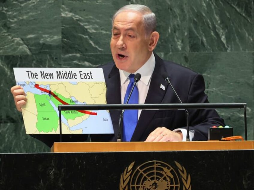 NEW YORK, NEW YORK - SEPTEMBER 22: Prime Minister of the State of Israel Benjamin Netanyahu holds up a map as he speaks during the United Nations General Assembly (UNGA) at the United Nations headquarters on September 22, 2023 in New York City. Heads of state and governments from at …