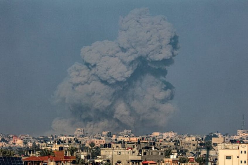 Smoke billows over Khan Yunis in the southern Gaza Strip during Israeli bombardment