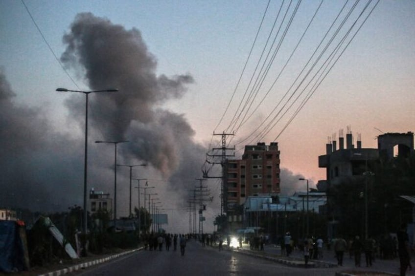 Smoke billows following an Israeli airstrike in Deir al-Balah in the central Gaza Strip