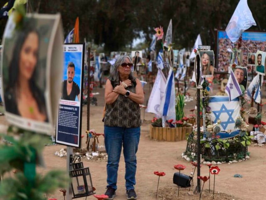 A woman visits an installation honouring those who were killed and kidnapped in the Supern