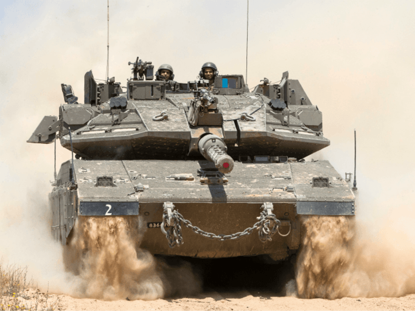 An Israeli tank rolls along the border between Israel and the Gaza Strip on May 6, 2016 as