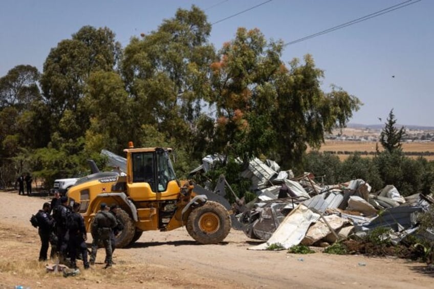 Israeli security forces demolish Bedouin homes in the Negev desert which authorities have