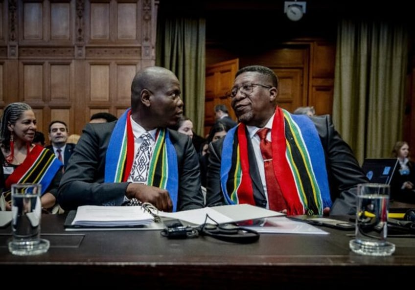 No armed attack, no matter how serious, could justify Israel's response, Justice Minister Ronald Lamola (left) told the court