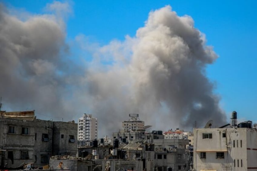 Smoke billows after Israeli bombardment in the vicinity of the Al-Shifa hospital in Gaza C