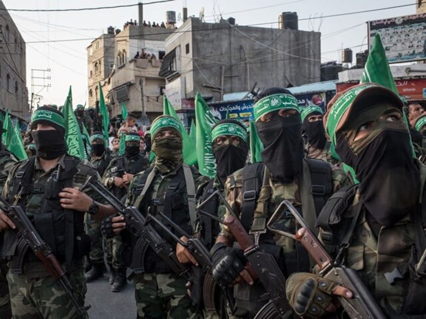 GAZA CITY, GAZA - JULY 20: Palestinian Hamas militants are seen during a military show in the Bani Suheila district on July 20, 2017 in Gaza City, Gaza. For the past ten years Gaza residents have lived with constant power shortages, in recent years these cuts have worsened, with supply …