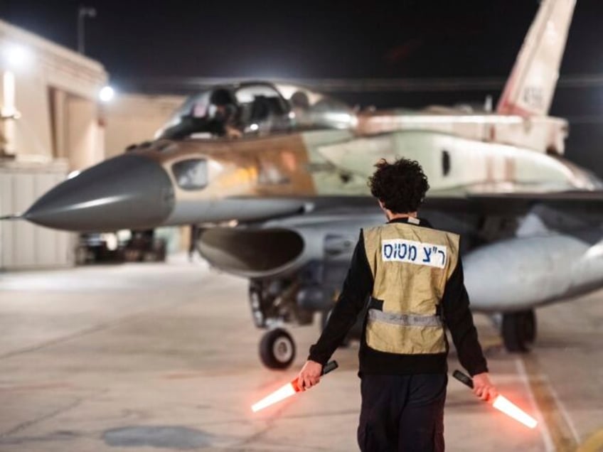 In this photo provided by the Israeli army, armed Israeli Air Force planes depart from an