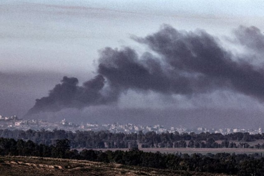 Smoke billows over heavily-bombed and besieged Gaza early on January 4, 2024