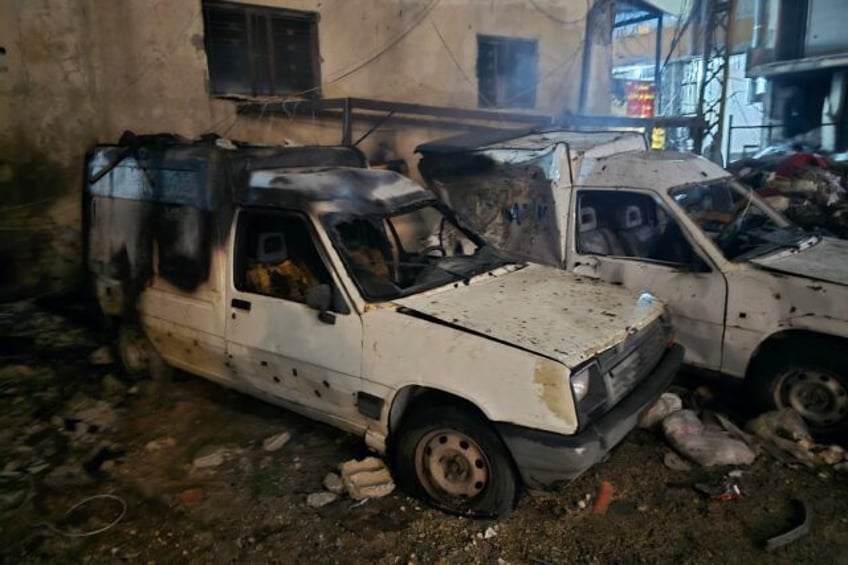 Damaged cars after an Israeli strike targeted a neighbourhood in the southern Lebanese cit