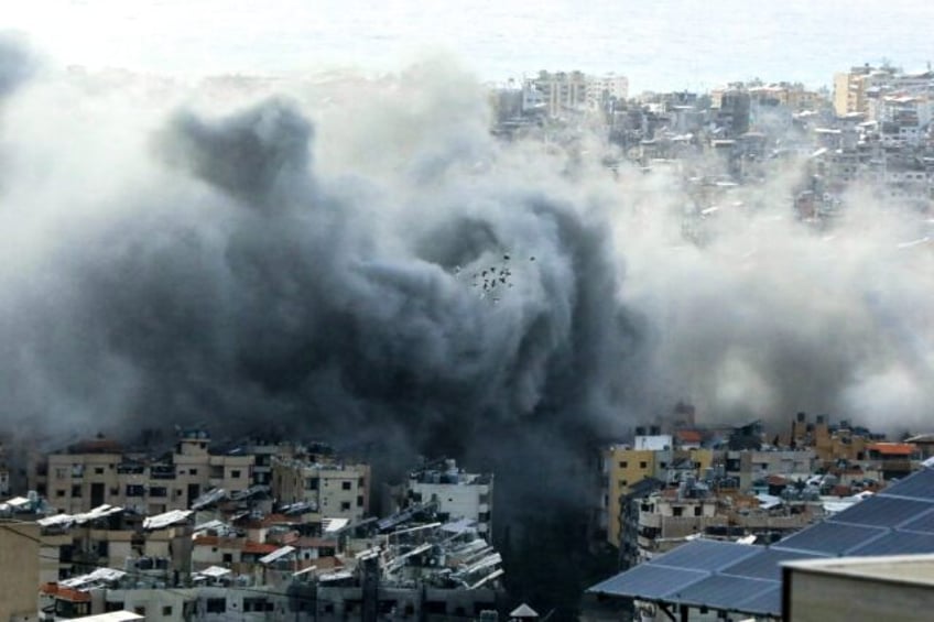 Smoke rises from the site of an Israeli air strike in Beirut's southern suburbs