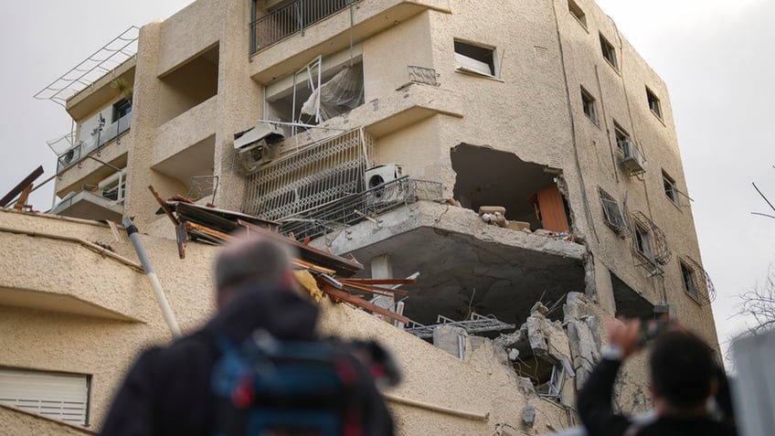 building in lebanon damaged by rocket fire