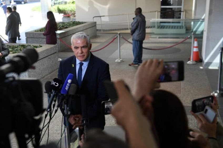 Israeli opposition leader Yair Lapid speaks to reporters after meeting with US Secretary o