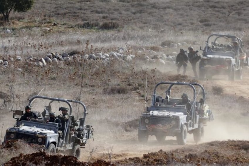 Israeli troops deploy inside the UN-patrolled buffer zone that is supposed to separate Isr