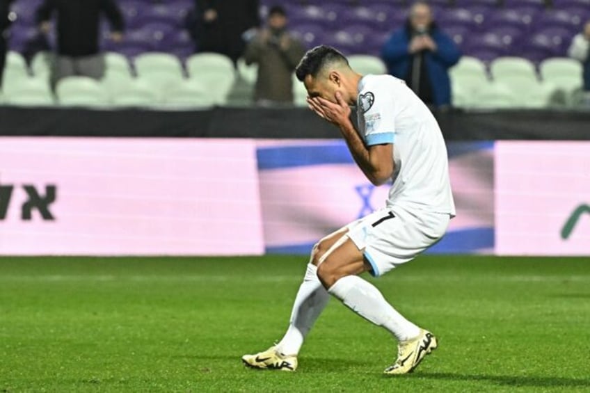 Tough moment: Israel's Eran Zahavi reacts as he misses from the penalty spot