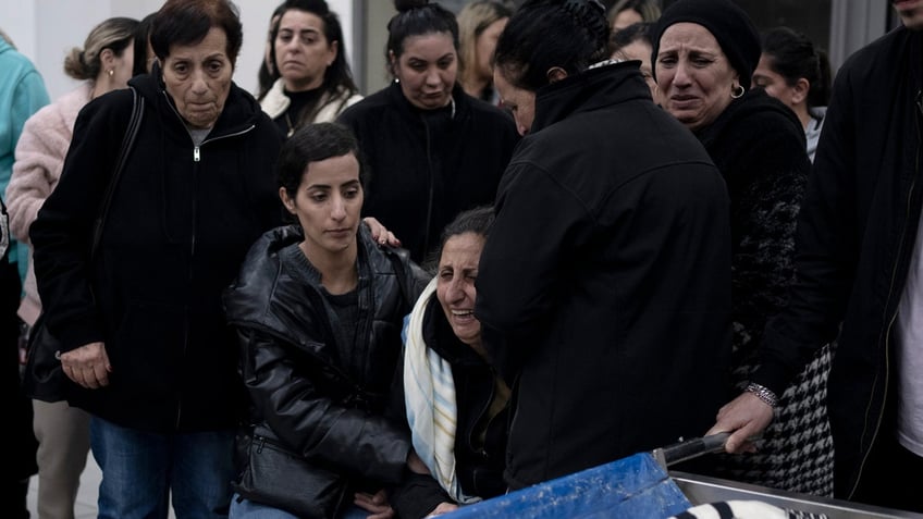 A funeral in the West Bank following a Palestinian shooting