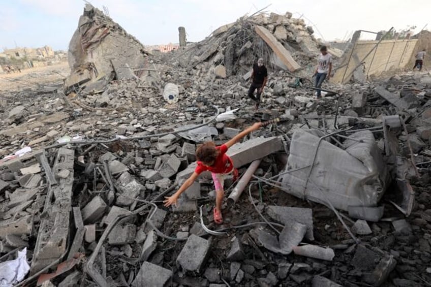 Gaza's civil defence agency said 52 were killed in a wave of Israeli airstrikes, shel