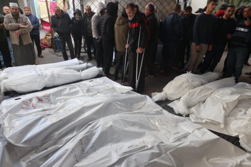 Palestinians in Rafah, the southern Gaza strip, mourn over bodies killed in Israeli bombardment