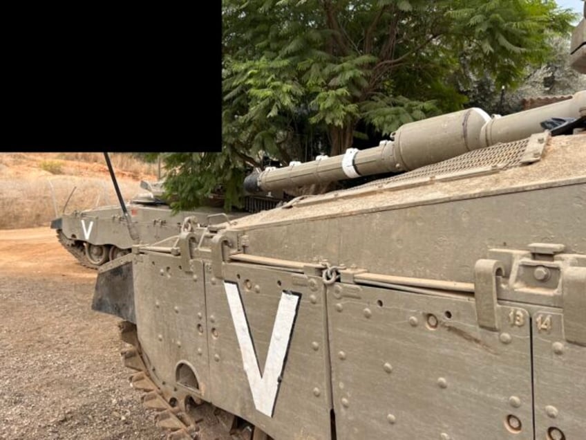 Israeli tanks sit ready near the Lebanese border. A black box has been added to the photo to obscure any possible identifying marks of the location. November 12, 2023 (Joel Pollak / Breitbart News)