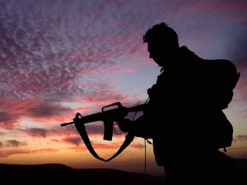 ISRAEL - FEBRUARY 8: In this photo distributed by the IDF February 8, 2003, an Israeli army paratrooper stands guard at sunrise during a brigade-wide exercise in northern Israel. For the part week, the elite paratroopers brigade has held a large-scale exercise as it takes a break from more than …