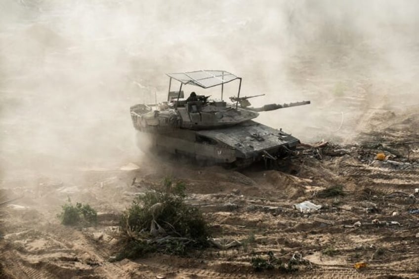 An Israeli tank is seen during operations around Jabalia in the northern Gaza Strip