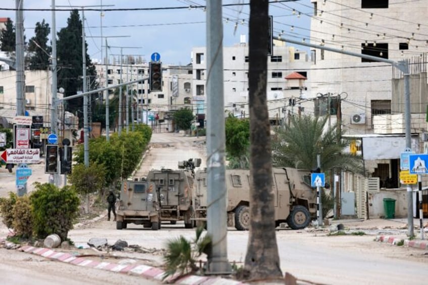 Israeli troops at the entrance to the occupied West Bank refugee camp of Tulkarem