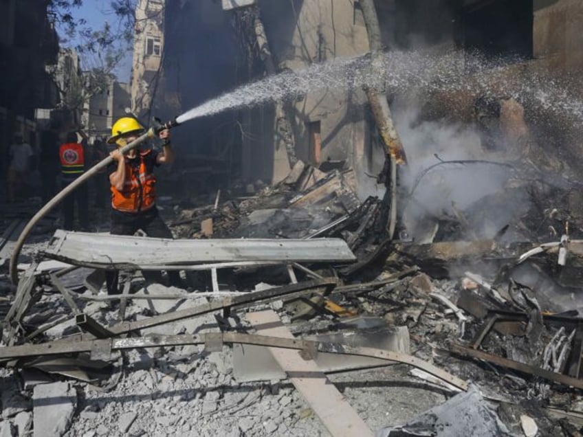 DEIR AL BALAH, GAZA - JUNE 08: Civil defense teams try to extinguish the fire that broke o