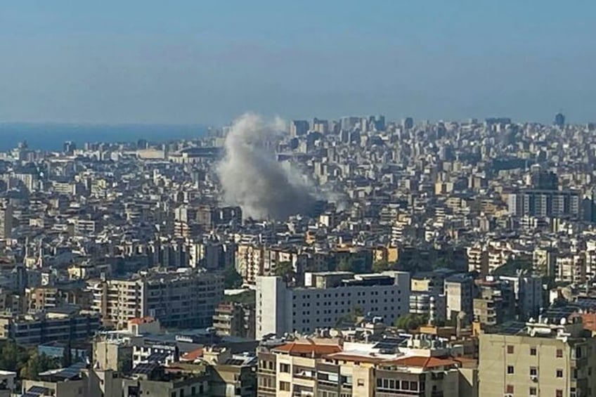 Smoke billowed over Beirut's southern suburbs after an Israeli air strike targeted the hea