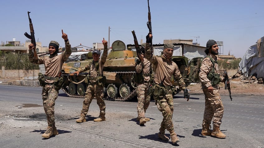 Men holding guns
