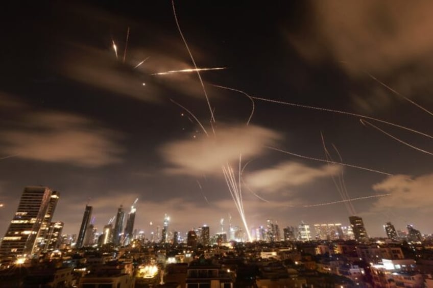 Israeli air defences intercept Iranian missiles over Tel Aviv