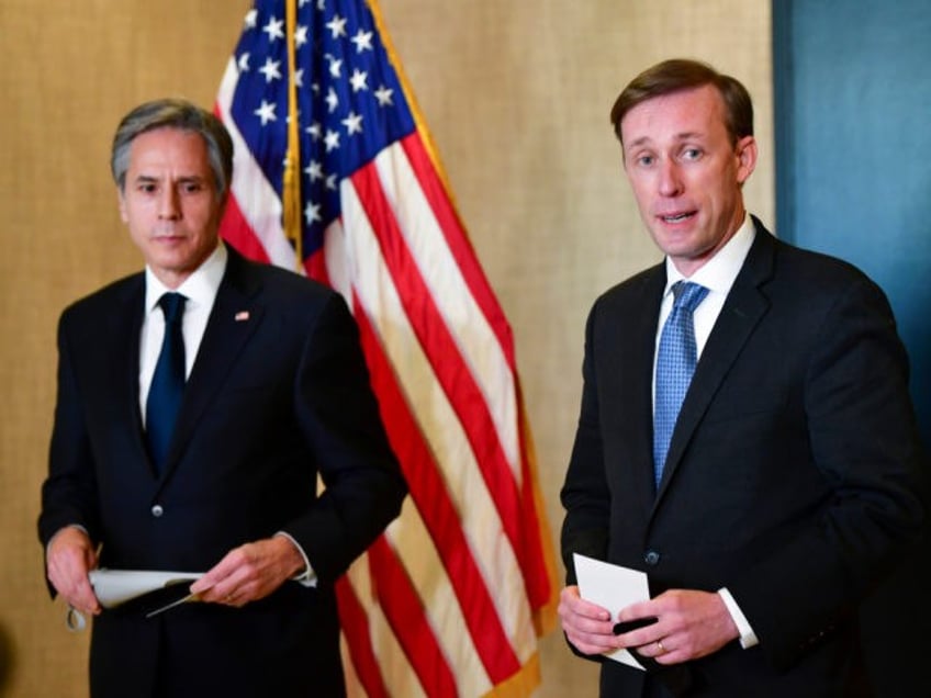 Secretary of State Antony Blinken, left, listens as National Security Adviser Jake Sulliva