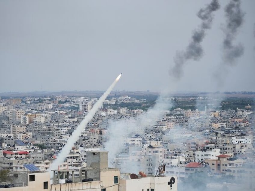 Rockets are launched by Palestinian militants from the Gaza Strip towards Israel, in Gaza, Saturday, Oct. 7, 2023. The militant Hamas rulers of the Gaza Strip carried out an unprecedented, multi-front attack on Israel at daybreak Saturday, firing thousands of rockets as dozens of Hamas fighters infiltrated the heavily fortified …