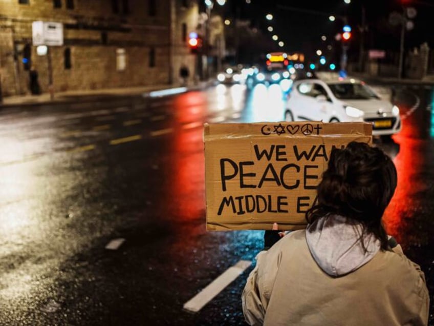 JERUSALEM, ISRAEL -- JANUARY 24, 2024: Protesters hold up signs for hostages in Gaza and c