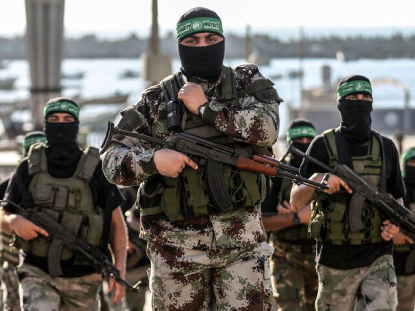 Gunmen from the Izz al-Din al-Qassam Brigades, the military wing of Hamas, during an anti-