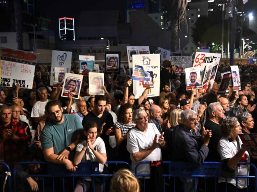 TEL AVIV, ISRAEL - NOVEMBER 25: Families of hostages and their supporters participate in the ‘50 Days of Hell’ rally in support of the 212 hostages that are still being held by Hamas, as another 13 Israeli hostages are supposed to be released from Gaza and brought back to Israel, …