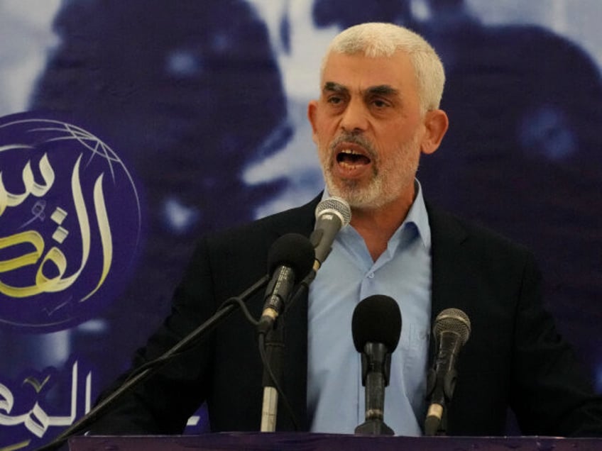 FILE - Yahya Sinwar, head of Hamas in Gaza, delivers a speech during at a hall on the seas