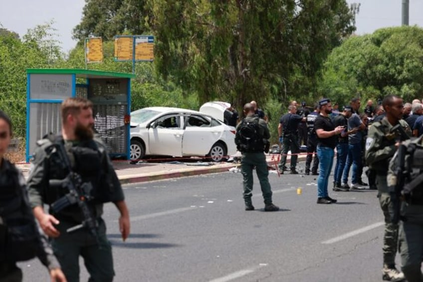 Israeli security forces cordon off the scene after police said a car rammed four soldiers